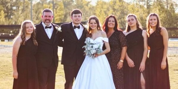 David and his family celebrating a wedding.